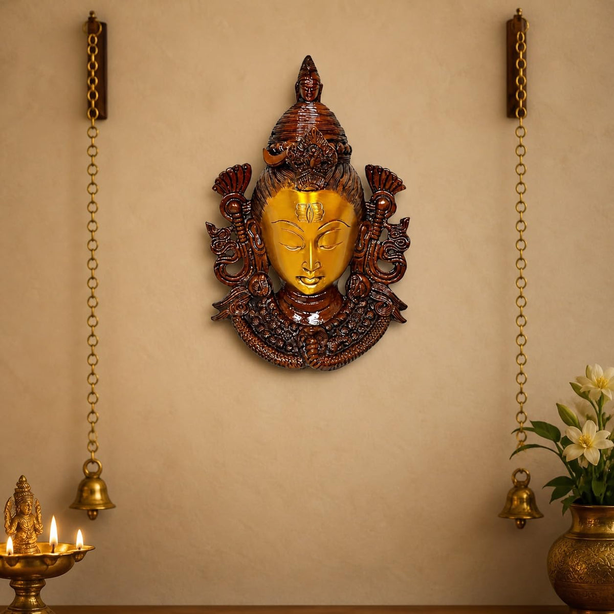 Brass wall hanging mask with gold-toned Shiva face and dark bronze detailing