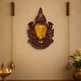 Brass wall hanging mask with gold-toned Shiva face and dark bronze detailing