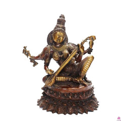 Brass Saraswati statue seated with veena, 18-inch height, detailed golden face