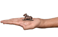 Copper Nandi cow idol on base held in hand for size