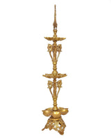 Brass diya stand with peacock finial, three tiers and detailed elephant side figures