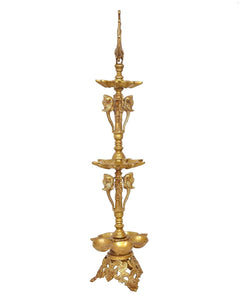 Brass diya stand with peacock finial, three tiers and detailed elephant side figures