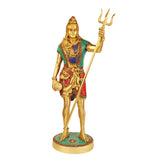Brass standing Bholenath idol with trident raised, colorful outfit, circular base