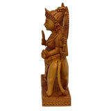 Carved wooden Durga statue, profile view with crown and halo, standing on carved base