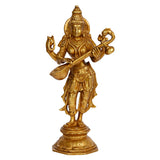 Gold-tone Maa Saraswati figurine standing with four arms holding a lotus and a corded item
