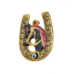 Horseshoe wall hanging with painted horse head, gold frame, and blue evil-eye bead
