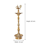 Brass peacock oil lamp stand; height 42 in, width 12 in, tiered base dish