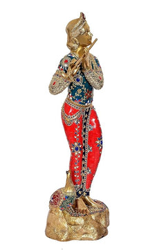 Krishna Murti brass statue from side view, hands in flute pose; blue-red patterned attire
