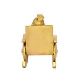 Back view of golden brass Ganesha statue on chair with rectangular backrest