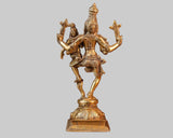 Brass Lakshmi Narasimha deity figurine on square base, arms extended with weapons