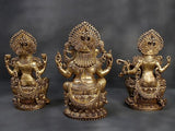 Brass Lakshmi, Ganesha & Saraswati idols from side angles, lotus pedestals