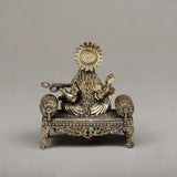 Brass Maa Saraswati seated sculpture from rear, detailed halo and ornate base legs