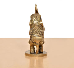 Brass elephant figurine, gold tone, rear view, engraved back armor, on round pedestal
