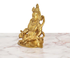 Brass Kuber Bhagwan murti, seated side view with arms and halo, 5 inch