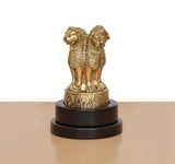 Brass Ashoka figurine side profile with ornate base medallions on revolving stand