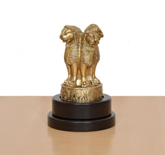 Brass Ashoka figurine side profile with ornate base medallions on revolving stand