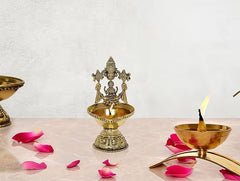 Brass Tirupatibalaji and Lakshmi oil lamp diya with ornate deity figure on pedestal tray