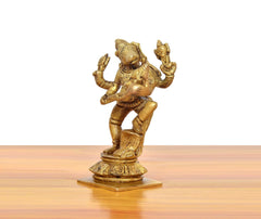 Golden brass Varaha-Lakshmi statue viewed from side; sculpted jewelry and arms