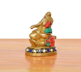Brass Ganesha statue blowing conch shell, front view, red, teal, and blue jewel accents