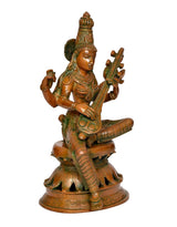 Maa Saraswati brass statue with veena, seated on ornate pedestal with cutout base