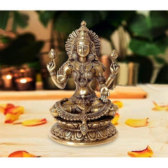 Brass Lakshmi Maa deity statue, seated with four hands and ornate jewelry