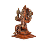 Brass Lakshmi Narasimha idol, side view showing multiple hands and ornate headdress