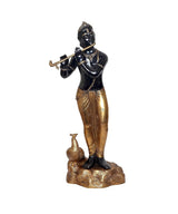 Krishna statue playing flute, front view, dark black torso with gold trousers and base