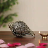 Brass conch showpiece with ornate carvings of Vishnu, Laxmi and Shesh Naag