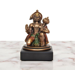 Resin Hanuman JI seated figurine with blessing gestures, detailed crown and ornaments.
