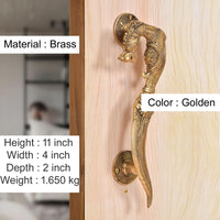 Golden brass yali-style door handles on plate, curved grip with engraved detailing