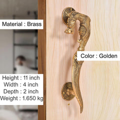 Golden brass yali-style door handles on plate, curved grip with engraved detailing