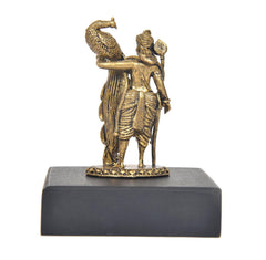 Close rear view: Lord Kartikeya Murugan with peacock emblem on gold base