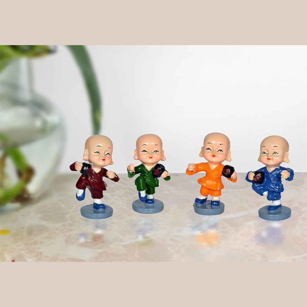 Resin kungfu monk figurines set in maroon, green, orange, blue, on round bases