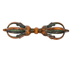 Brass dorje with eight-pronged shape, symmetrical carved details in multicolor patina