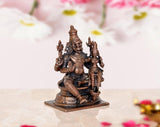 Angle view copper Lakshmi Narasimhar idol with smaller figure beside it, on base