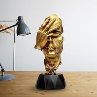 Gold-faced polyresin bust table decor with raised hand, black base, front view