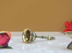 Brass pooja bell dome with striker handle, engraved metalwork