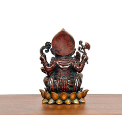 Ganesha brass idol from behind with large crown, hands raised, lotus base, 5 in