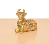 Brass Nandi idol figurine with multicolor Meenakari, kneeling seated pose, side view