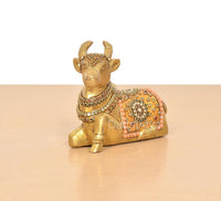 Brass Nandi idol figurine with multicolor Meenakari, kneeling seated pose, side view