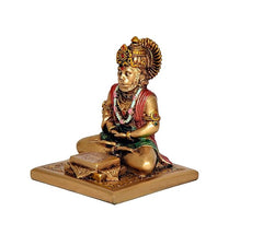 Hanuman JI resin statue side view, red robe and green sash with gold base and book