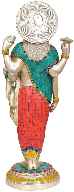 Brass Dhanvantari statue back view, silver halo disk above teal and red mosaic torso