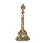 Brass pooja bell upright with detailed top finial and engraved lower bell