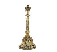 Brass pooja bell upright with detailed top finial and engraved lower bell