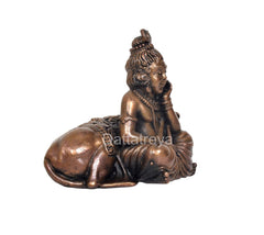 Copper Bal Gopal idol seated on cow, rear angle showing back and hair details