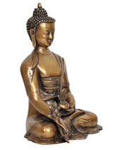 Brass Buddha idol seated cross-legged, dhyan mudra gesture, detailed robe and lotus