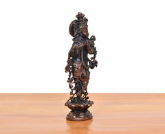 Copper Krishna playing flute murti, rear view with detailed ornaments and crown.