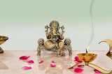 Brass Ganesha statue seated on ornate throne, 4-inch height, highly detailed