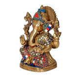 Brass Ganesha statue idol holding blessing gesture, colorful patterned outfit and crown