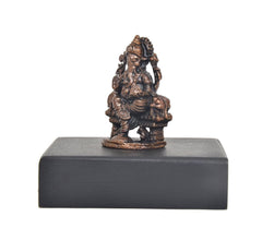 Copper Lord Ganesha idol side profile on square dark pedestal base